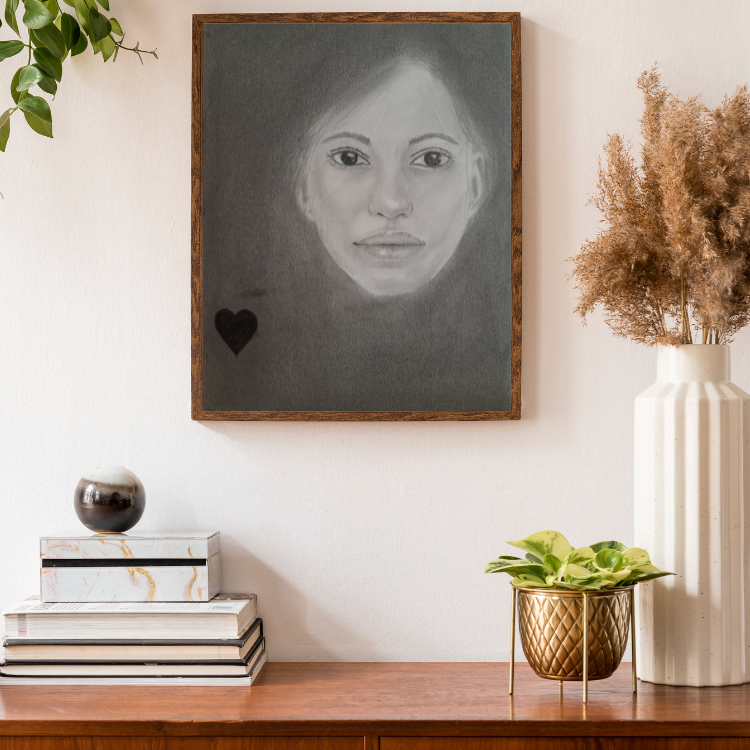 artwork 8 is framed and hung on a wall surrounded by a desk and home accessories